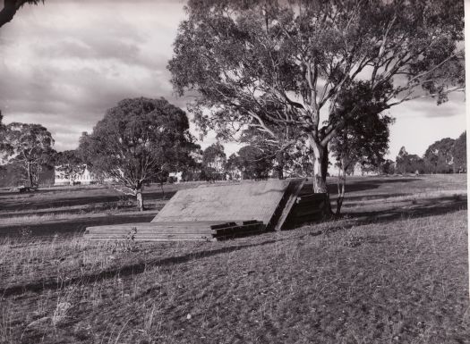 Materials stacked for Administration Building from near the corner of East Road and Ellery Circuit. Canberra High School is in the background.