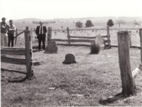 Three men at the old Glenburn cemetery in Kowen where members of the pioneering Colverwell family are buried. Alan Fitzgerald is wearing the suit and tie.