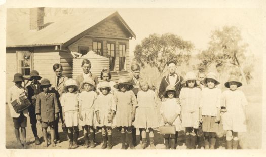 School pupils and teacher. Ten girls and eight boys at a school near Rye Park.