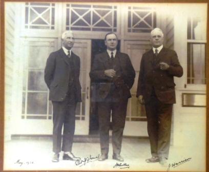 Framed photograph of Colonel T.J. Thomas, Sir John Butters and Sir John Harrison, members of the Federal Capital Commission (FCC), May 1928. Includes the men's signatures.