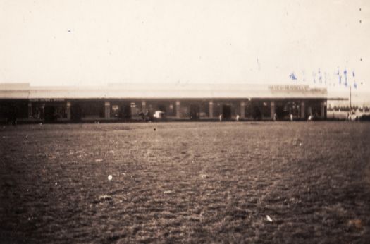 A distant view of the Kingston shops from across Giles St. Hayes & Russell are on the corner of Giles and Kennedy Sts.