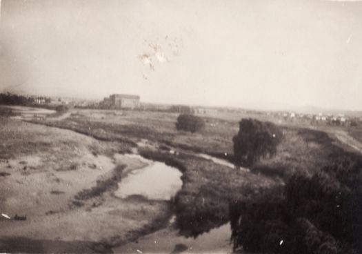 The Molonglo River with the Power House in the distance. The river has little water in it.