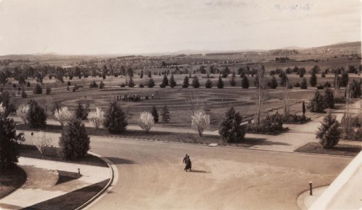 Rose Gardens and City area from the roof of Parliament House. Gathering at centre.