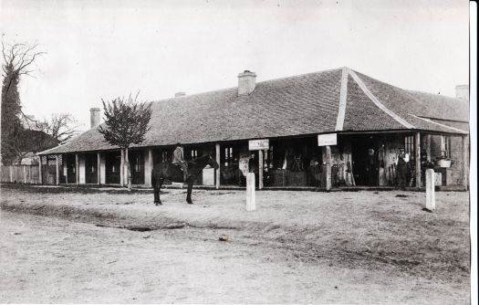 Walker's Store, at 7 McQuoid Street Queanbeyan. Originally the Harp of Erin Inn. Photograph taken 1887