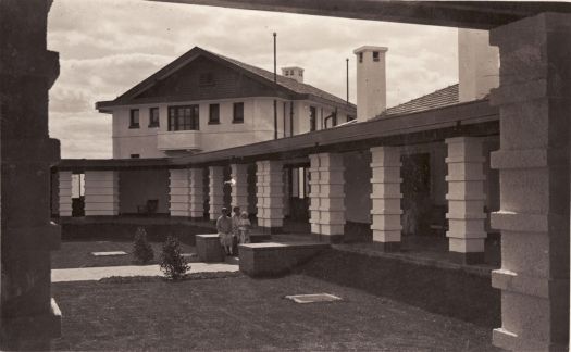 Hotel Canberra, internal courtyard with two women and a child