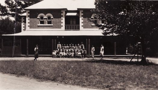 The front of Glebe House (built 1872) with school children being photographed. St Gabriels' Church of England Girl's Grammar School occupied the building from June 1926 to September 1927.