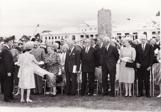 Royal visit, Queen Elizabeth II, shaking the hand of Mrs Arthur Campbell in front of old Parliament House.