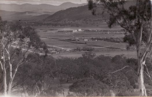 Early view from Mt Ainslie to Civic. Possibly showing Ainslie tradesmen's camp.