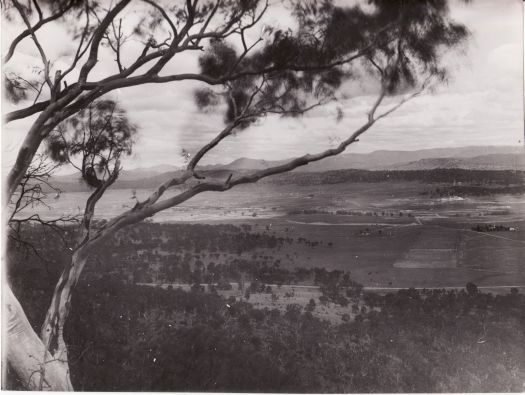 View to Parliament House from Mt Ainslie. The old Yass Road is in the foreground.