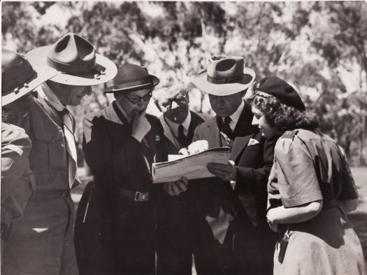 Lord and Lady Baden-Powell map reading. Left to Right: ?, Lord Baden-Powell, Lady Baden-Powell, Goodwin, Daley, Margaret Dally.