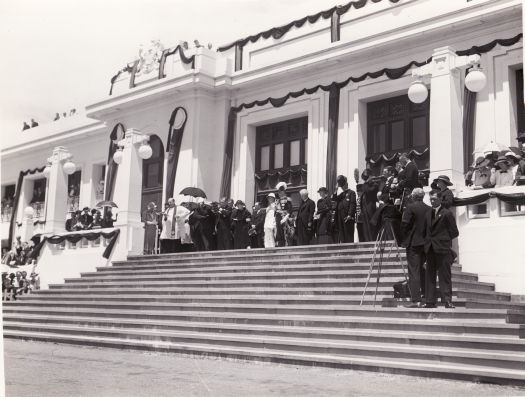 Memorial service for King George V. Standing on the front steps of Parliament House are Henry Gullett, Eric Harrison, Lord Gowrie, Joe Lyons, Enid Lyons, R.G. Casey.