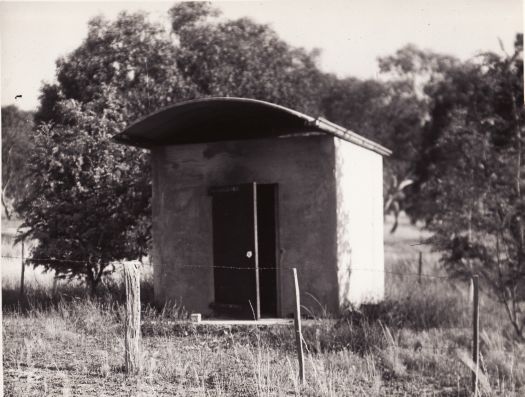 Survey Hut from Scrivener's camp, Capital Hill. The site has an old fence and is surrounded by the bush.