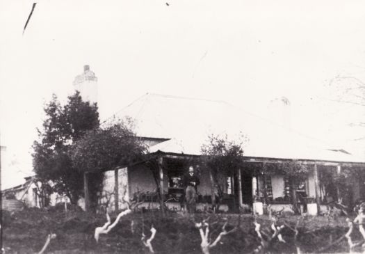 Unidentified man in front of Acton House on the Canberry Plains