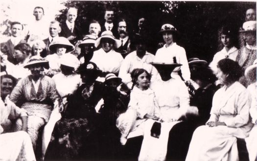Portrait of a group of people at the home of C.R. Scrivener. Scrivener lived at Acton House.
