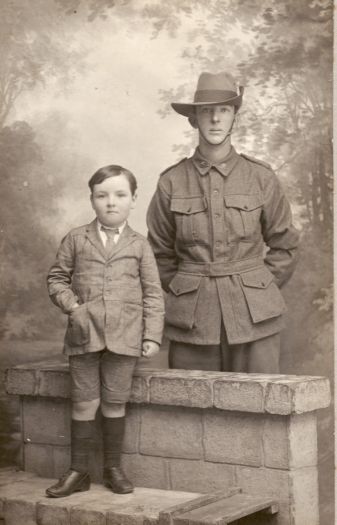 John Wark in soldiers uniform with a small boy