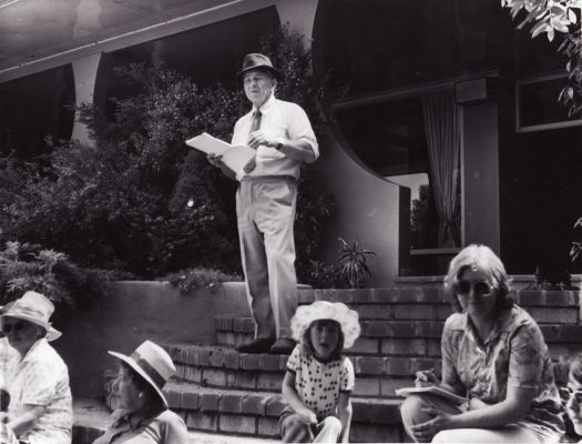 Mr Hyles on steps of Booroomba Homestead giving a talk on the early history of the area.