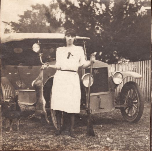 Veria Nolan with hare shot at 'Springfield', gun and car.