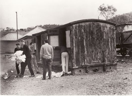 Clearing papers from shed