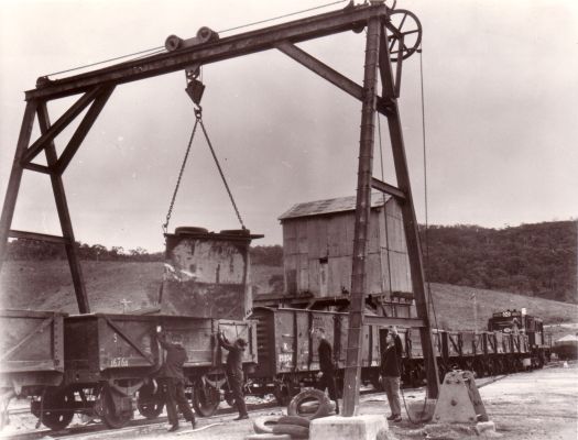 Goods train being loaded by overhead crane, Captains Flat