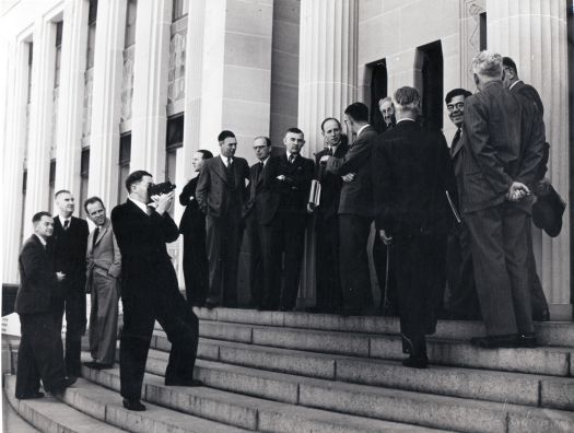 Group of men on steps of Institute of Anatomy? including HC Coombs, Sir John Medley, CS Daley, HH Bailey, RR Garran, RD Wright