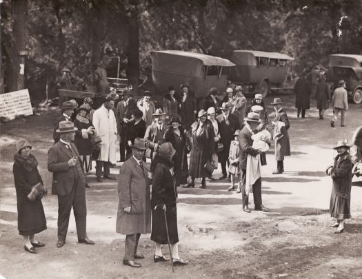 A group of well dressed people c1920s at the Cotter Reserve with cars in the background.