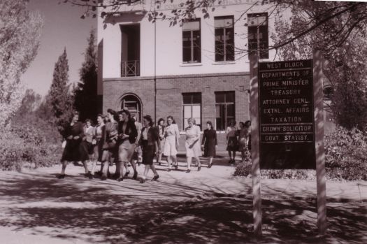 Office workers leaving the front entrance of West Block, Queen Victoria Terrace, Canberra.