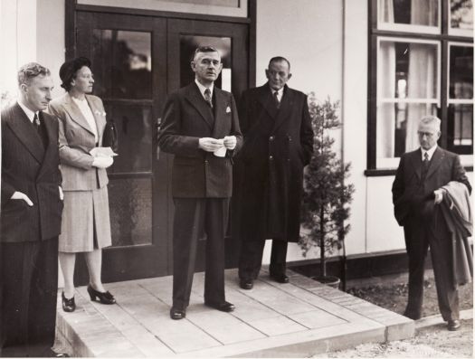 Five people at unidentified occasion, C.S. Daley in the middle.