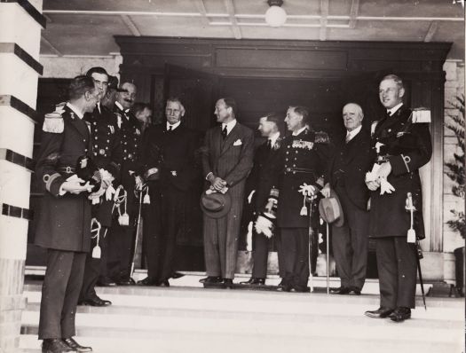 Admiral Kayser of the Dutch Naval Squadron, five brother officers and the Consul General being welcomed by the Civic Administrator Mr C S Daley at Hotel Canberra where they were entertained by the Commonwealth Government at lunch. Messers Fenton Blakeley and Senator Kingsmill are also pictured in the photograph.