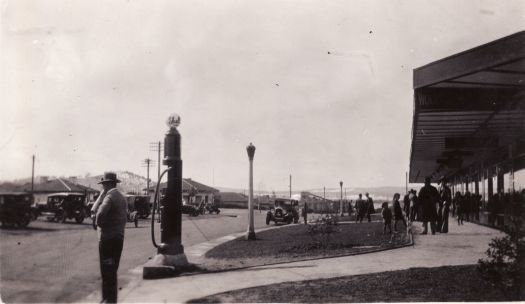 Giles Street, Eastlake (Kingston) Shopping Centre with cars, pedestrians and Shell petrol pump