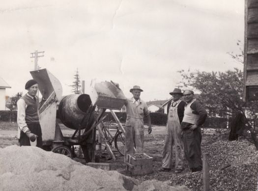 Russian Orthodox Church - four men with a concrete mixer