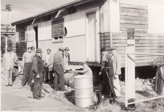 Russian Orthodox Church - group of 11 men in front of prefab including Joe Alexander.