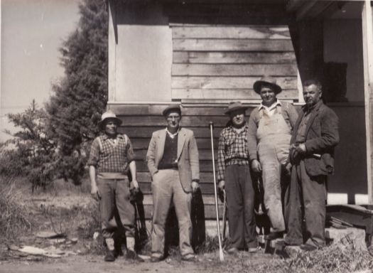 Russian Orthodox Church - group of 5 men in front of hut