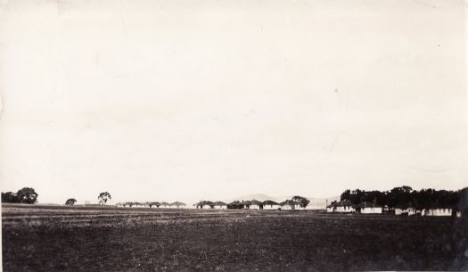 Distant view of weatherboard cottages on the road to Yass