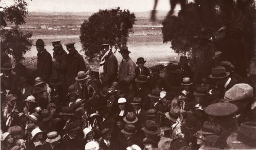 Crowd scene at stone-laying ceremony