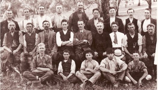 Portrait of 23 men and boys employed as plumbers on construction of the Royal Military College, Duntroon