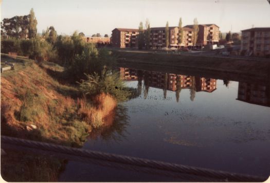 Block of flats reflected in Queanbeyan River