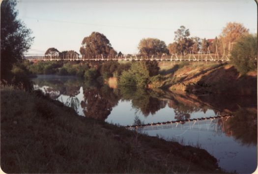 Suspension bridge reflected in Queanbeyan River