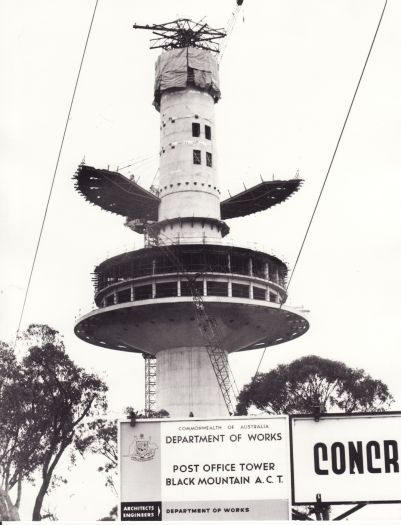 Black Mountain Tower, unfinished. Image shows the Department of Works sign stating that the tower was a Post Office Tower. Part of the sign for Concrete Constructions is also visible.