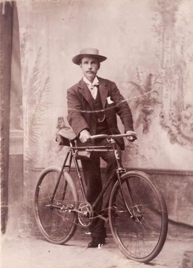 Portrait of unnamed man with bicycle