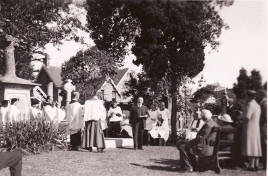 Mr Percy Walter Gledhill (1890-1962) giving an address in a churchyard 