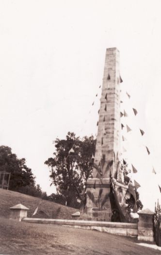 Captain Cook memorial at Kurnell, on the shore of Botany Bay, erected in 1870. The memorial is festooned with pennants.