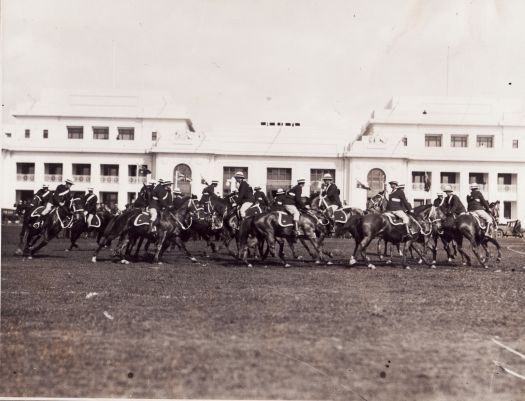 Mounted police practicing riding revolutions in front of Parliament House prior to the opening of Parliament House