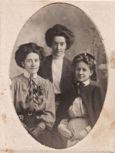 Portrait of three unnamed young women