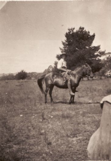 Unnamed man on a horse