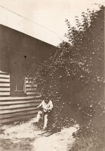 Lach in the garden on a bicycle