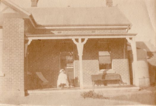 Fanny, a nurse sitting on verandah