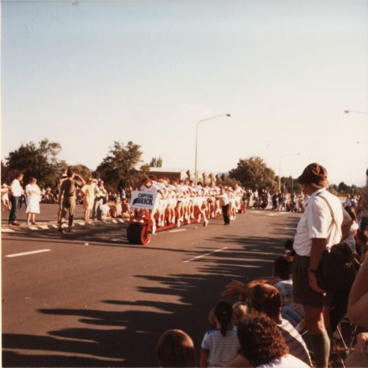 A person bicycle in the Canberra Day Parade on London Circuit (near YWCA)