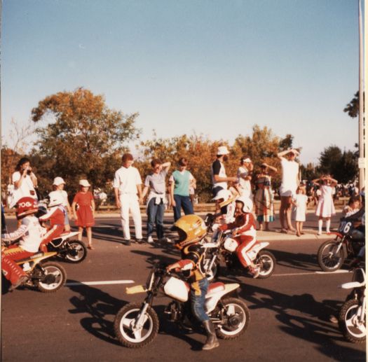 Children on mini bikes in the Canberra Day Parade on London Circuit (near YWCA)