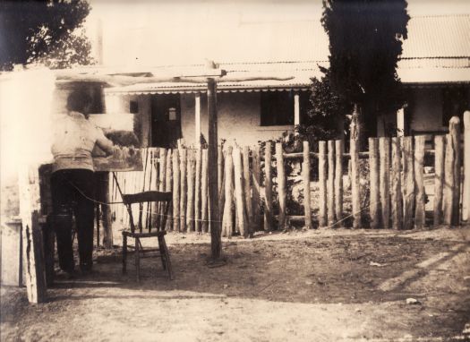 Canberra Post Office. Also known as the Ainslie Post Office. A man is painting a picture of the building.