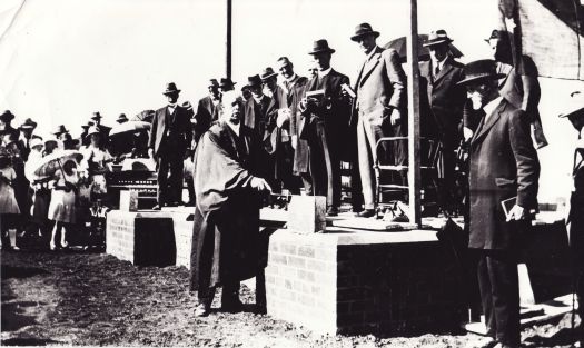 Group of a people at a ceremony to lay a foundation stone.